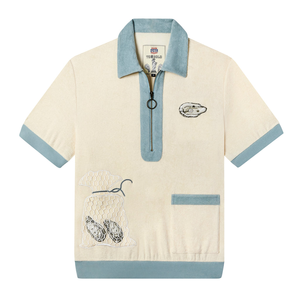 Tombolo organic cotton terry cloth cabana shirt with embroidered oyster motifs on left breast and right pocket with mesh netting, blue lining and half-zipper against white backdrop.