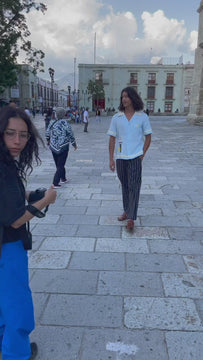 Video of man walking through town wearing baby blue Tombolo Martini shirt