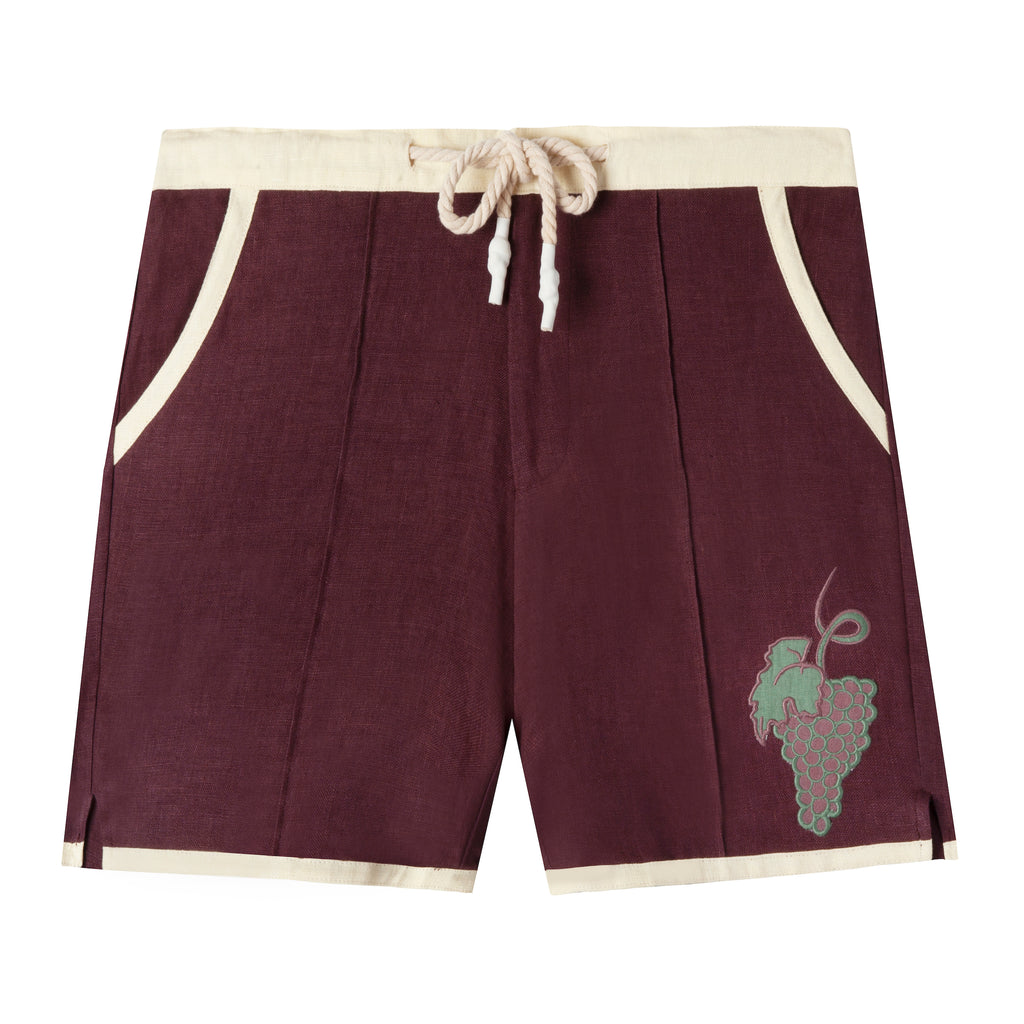 Eggplant-colored linen cabana shirts with appliquéd and edge-embroidered grape vine