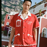 male model in the full matching set in front of buildings