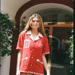 Woman wears Finestra set outside the front entrance of Le Sirenuse hotel