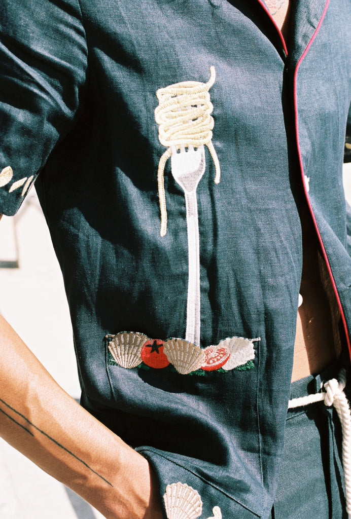 Close up of the embroidered fork with spaghetti