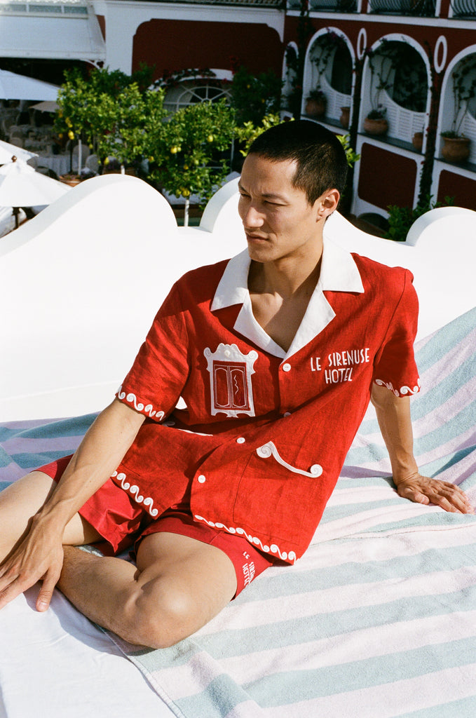 Man rests in loungechair looking off into the distance wearing the finestra set