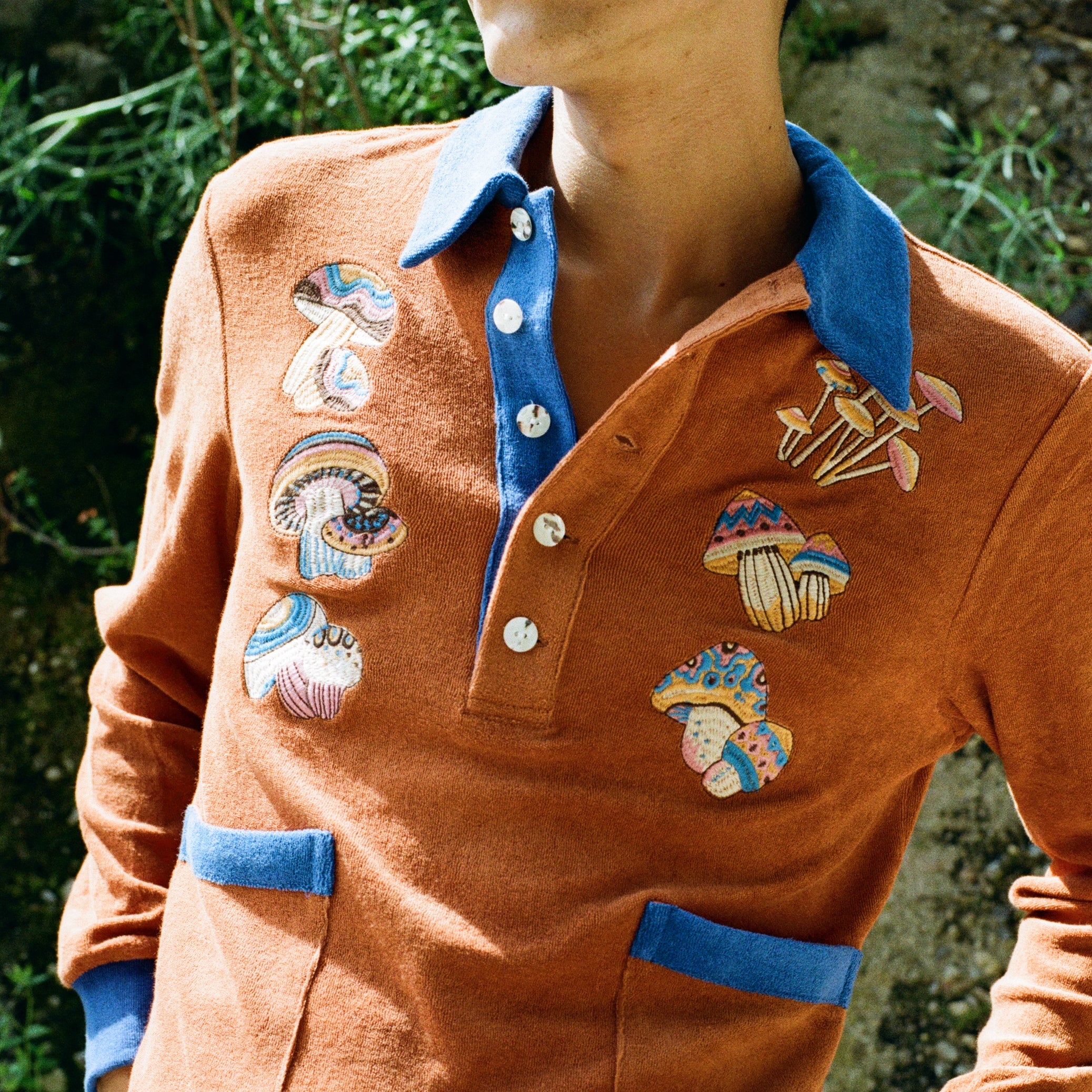 male model looking outwards in cabana with hands in stowaway shorts pockets