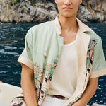Man wearing unbuttoned Liguori shirt with collar popped