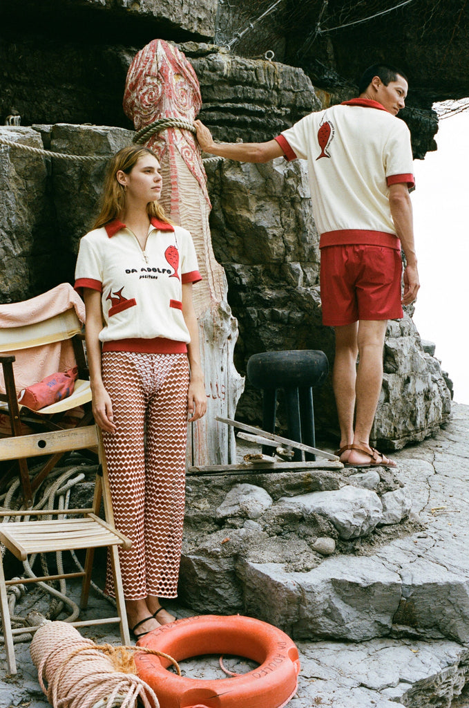 woman looks off into the distance while Man turns his back on the camera