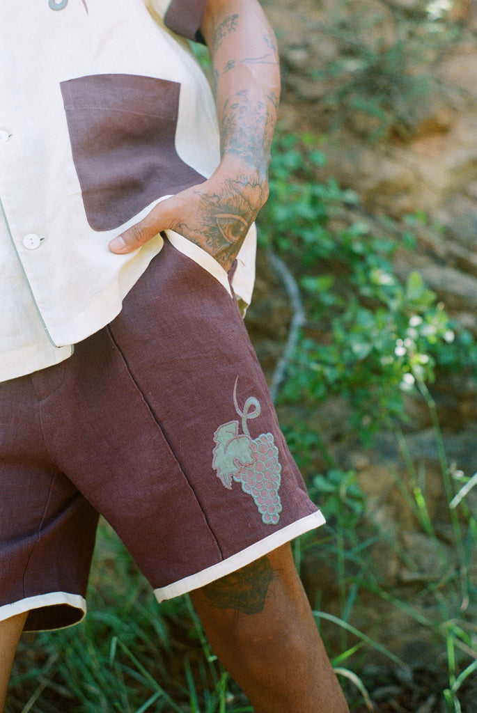 Detail shot of appliquéd and edge-embroidered grape bunch.