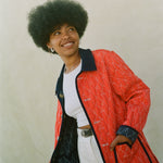 Woman wears red reversible jacket