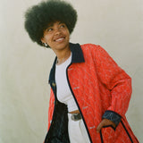 Woman wears red reversible jacket