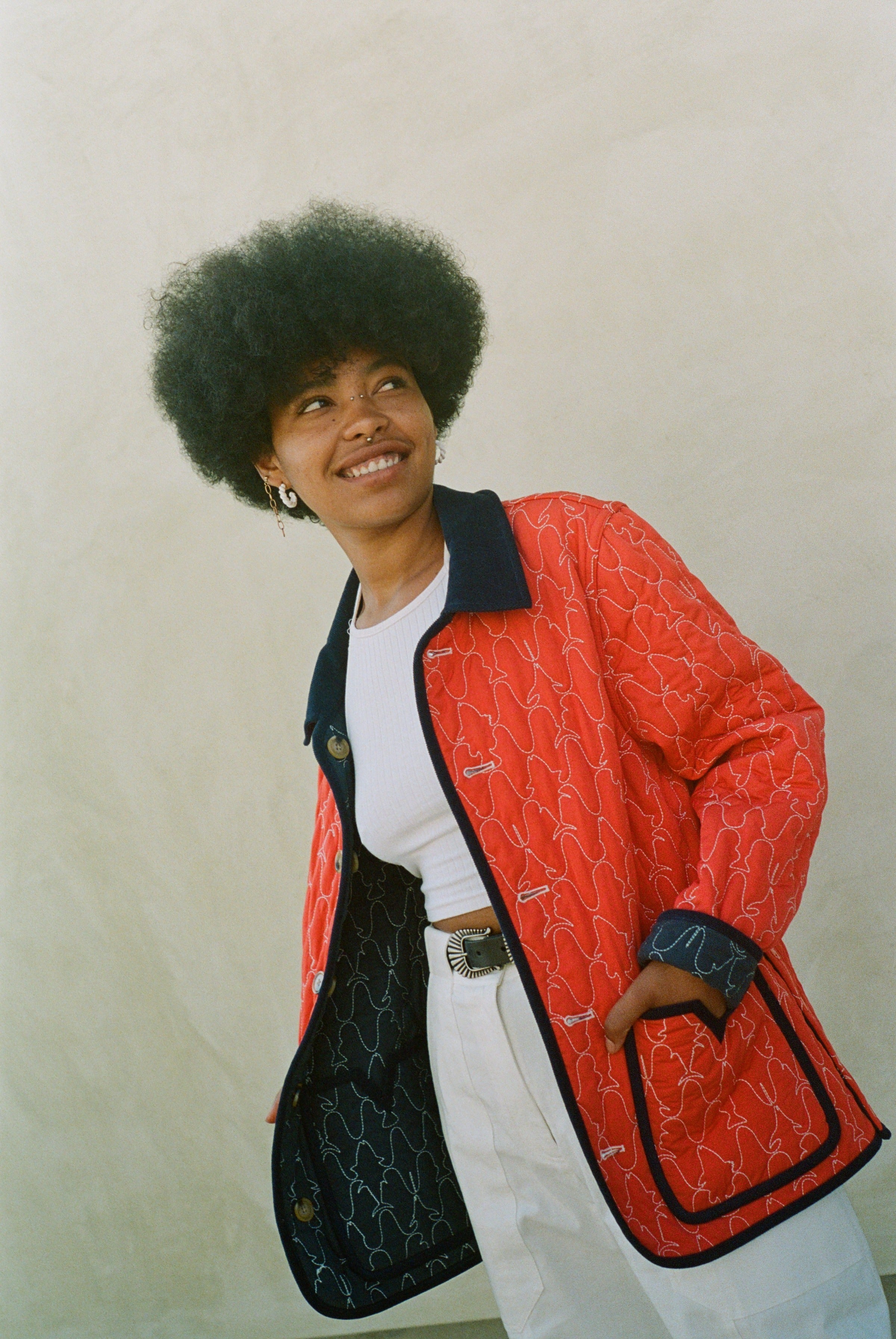 Woman wears red reversible jacket