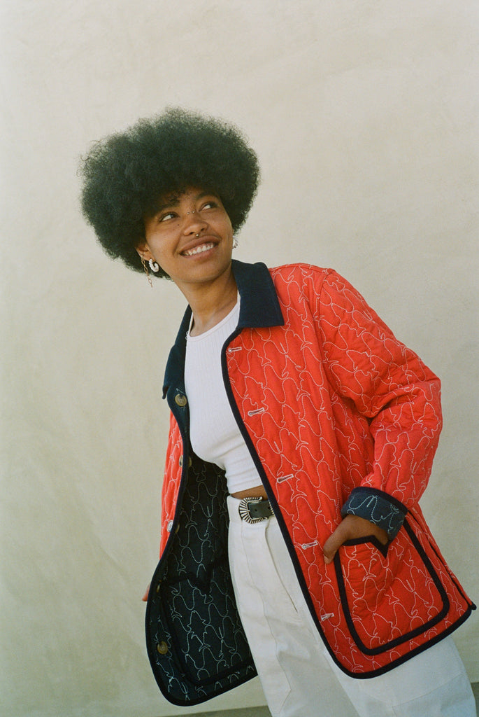 Woman wears red reversible jacket