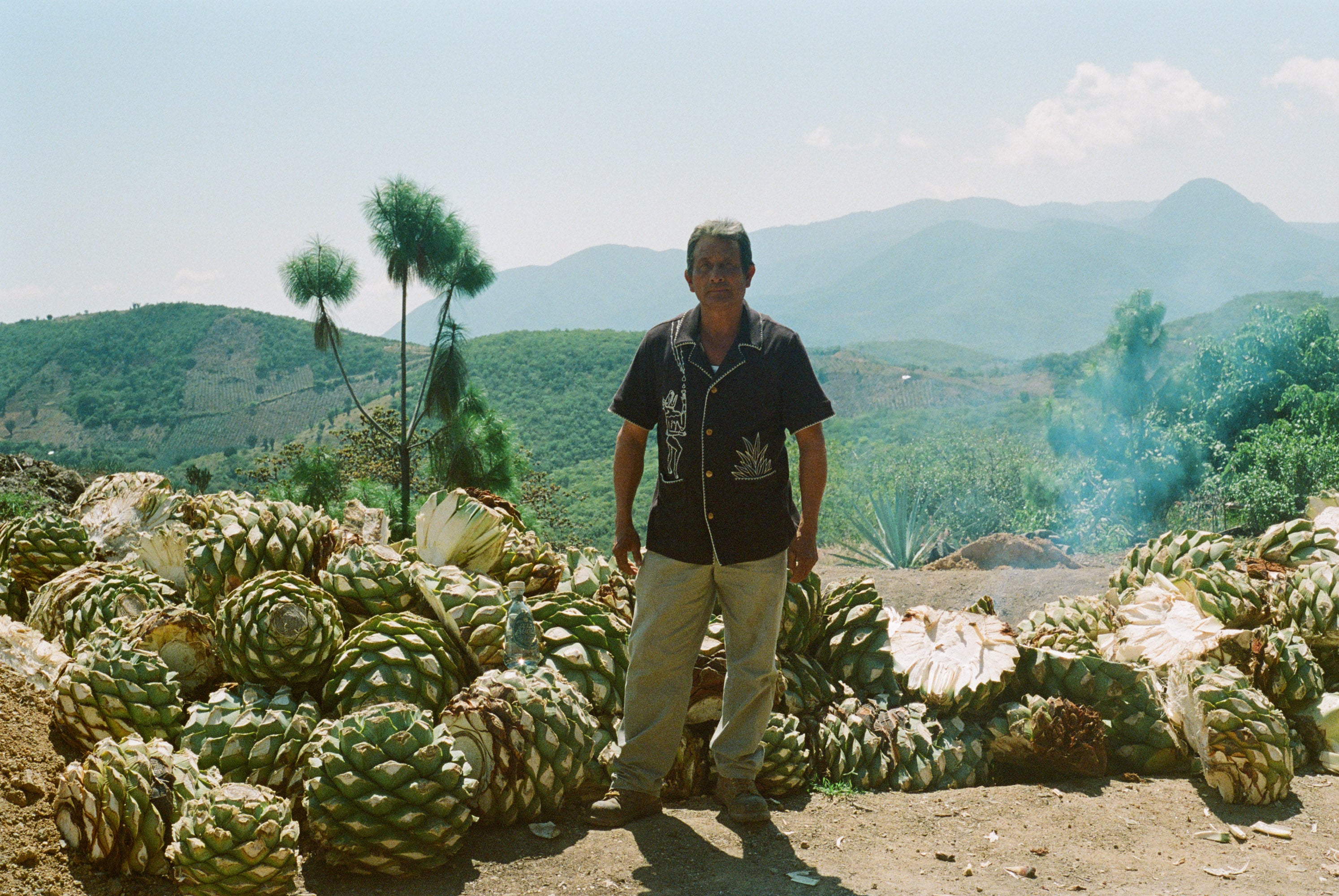 Man on mountain wearing Tombolo Agua Magica terry cloth Cabana shirt