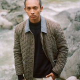 Man looks at camera in jacket