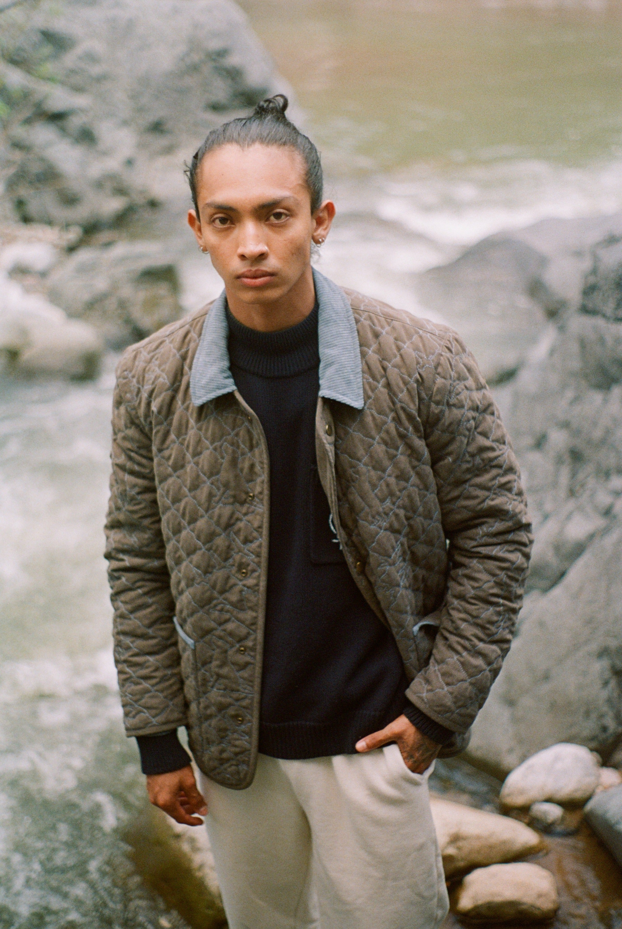 Man looks at camera in jacket