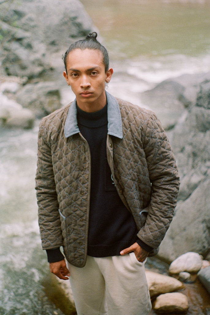 Man looks at camera in jacket