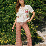 Woman holding hand on hip while posing in the just a pinch cabana shirt