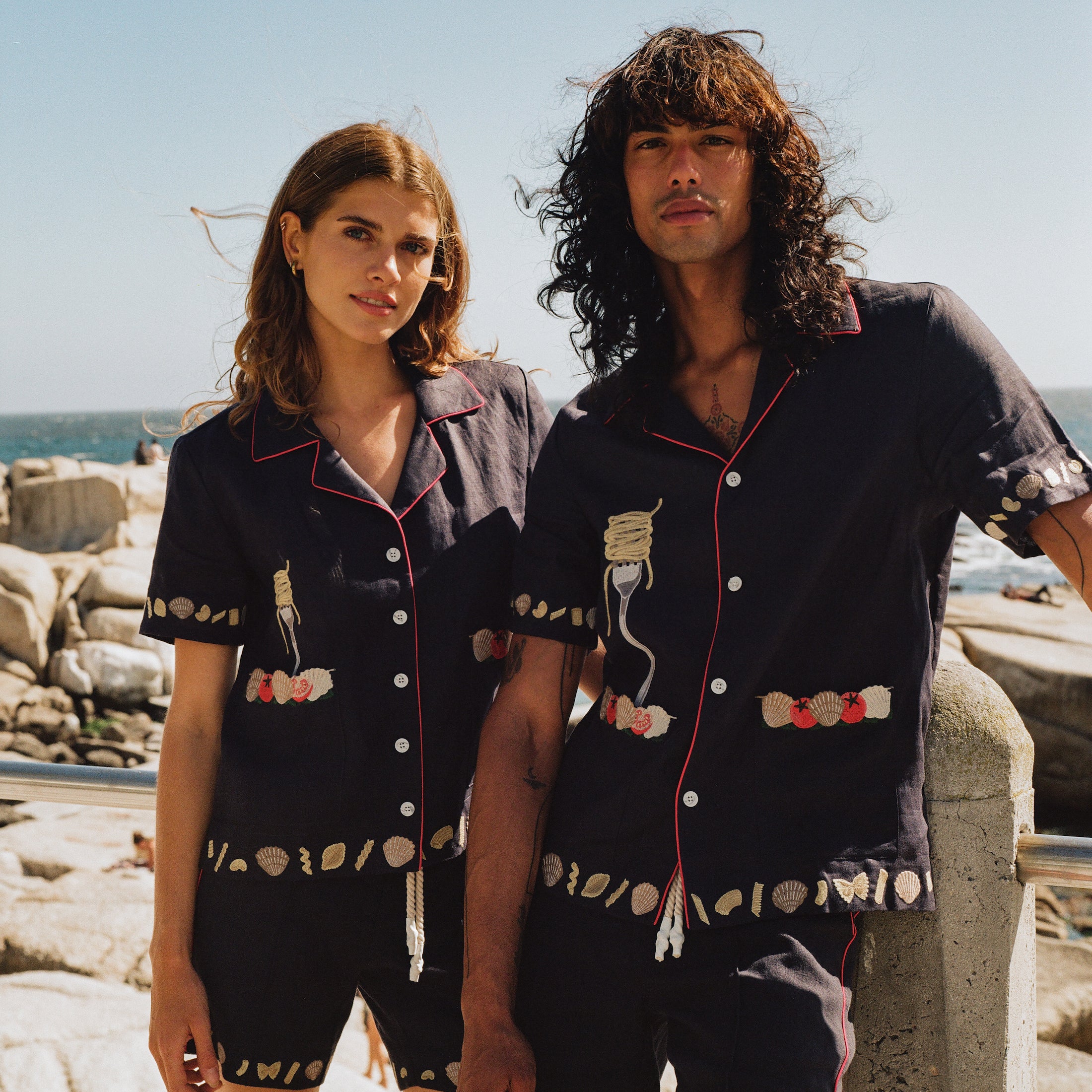 Male and female models on the beach wearing the full matching set