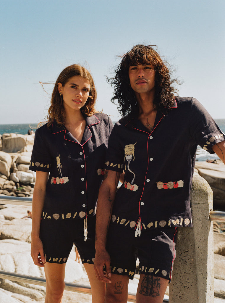 Male and female models on the beach wearing the full matching set