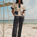 Man on beach wearing navy version of Easy going pants