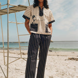 Man on beach wearing navy version of Easy going pants