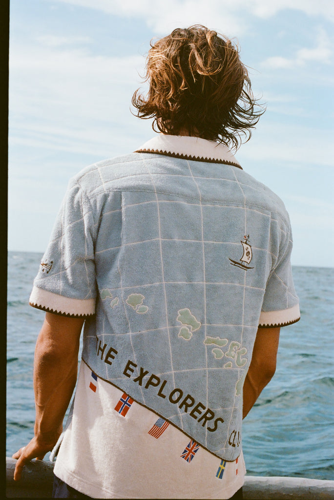 Male Model with long hang is showing off the backside of 'The Explorers Club' Expedition Cabana