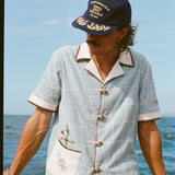 Male model wearing 'The Explorers Club' Expedition Cabana with a Wool Explorer's Club Hat. 