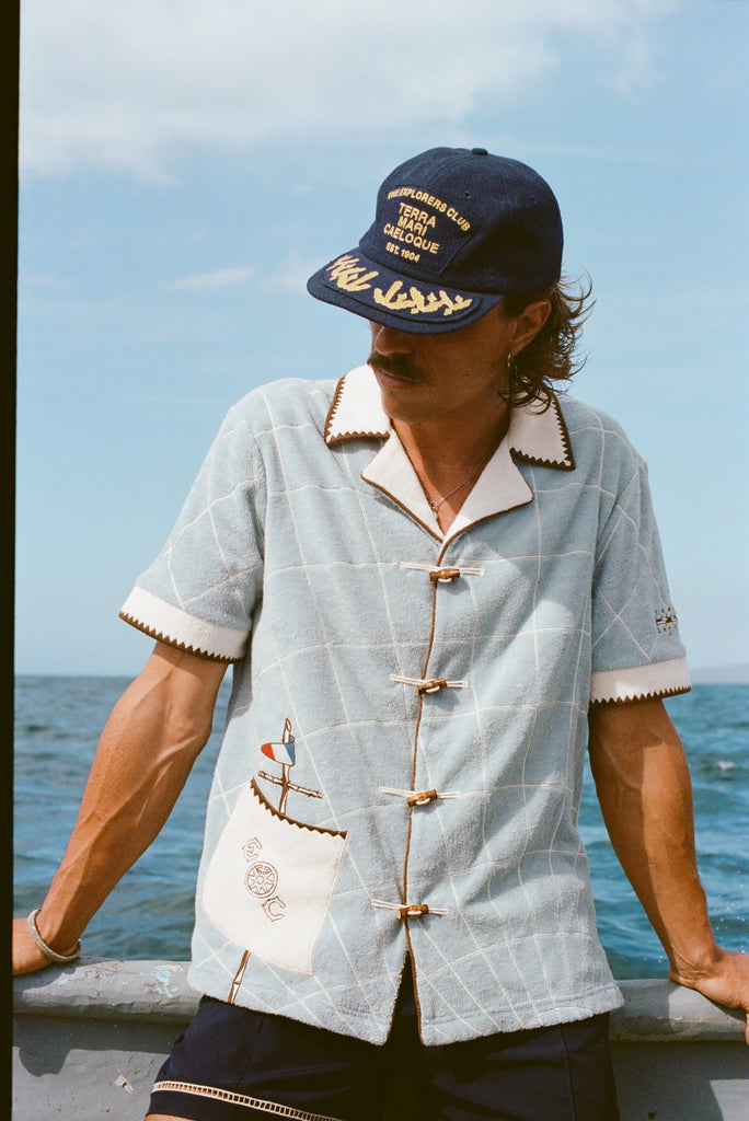 Male model wearing 'The Explorers Club' Expedition Cabana with a Wool Explorer's Club Hat. 