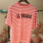 Red and white striped t-shirt with 'LE SIRENUSE' text on a hanger.