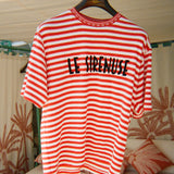 Red and white striped t-shirt with 'LE SIRENUSE' text on a hanger.