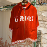 Le Sirenuse Beach Towel Top hanging outside by the pool. 