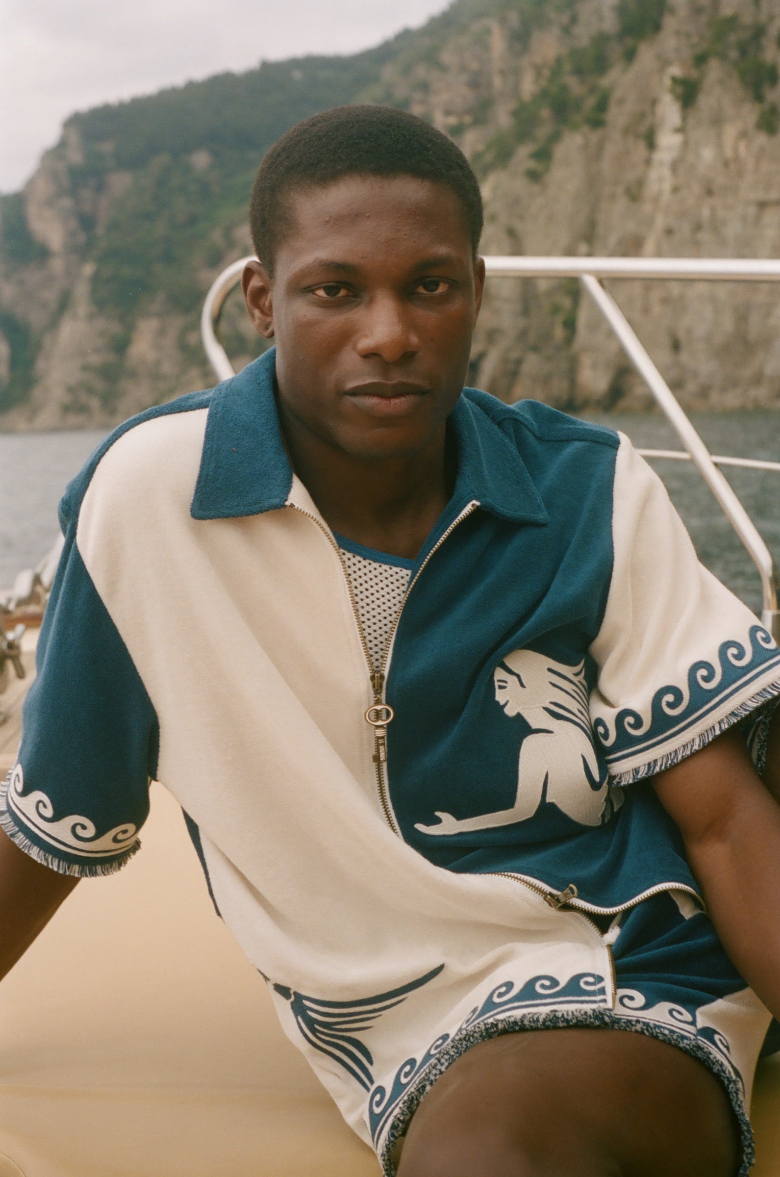 Man wearing blue and beige Late Checkout Cabana.