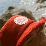 Close-up of the Le Sirenuse bucket hat patch.