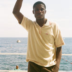 Man wearing beige Le Sirenuse polo.
