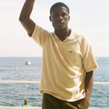 Man wearing beige Le Sirenuse polo.