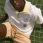 Man wearing FIFA Polo shirt, with 'I was there in..." chain-stitch embroidery over the chest pocket. He is also wearing a matching bucket hat.