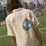 Back of beige camp collar FIFA World Cup shirt.