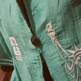 Close-up of the soccer zipper pull on the teal cabana. 