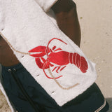 Close-up image of red embroidered lobster.