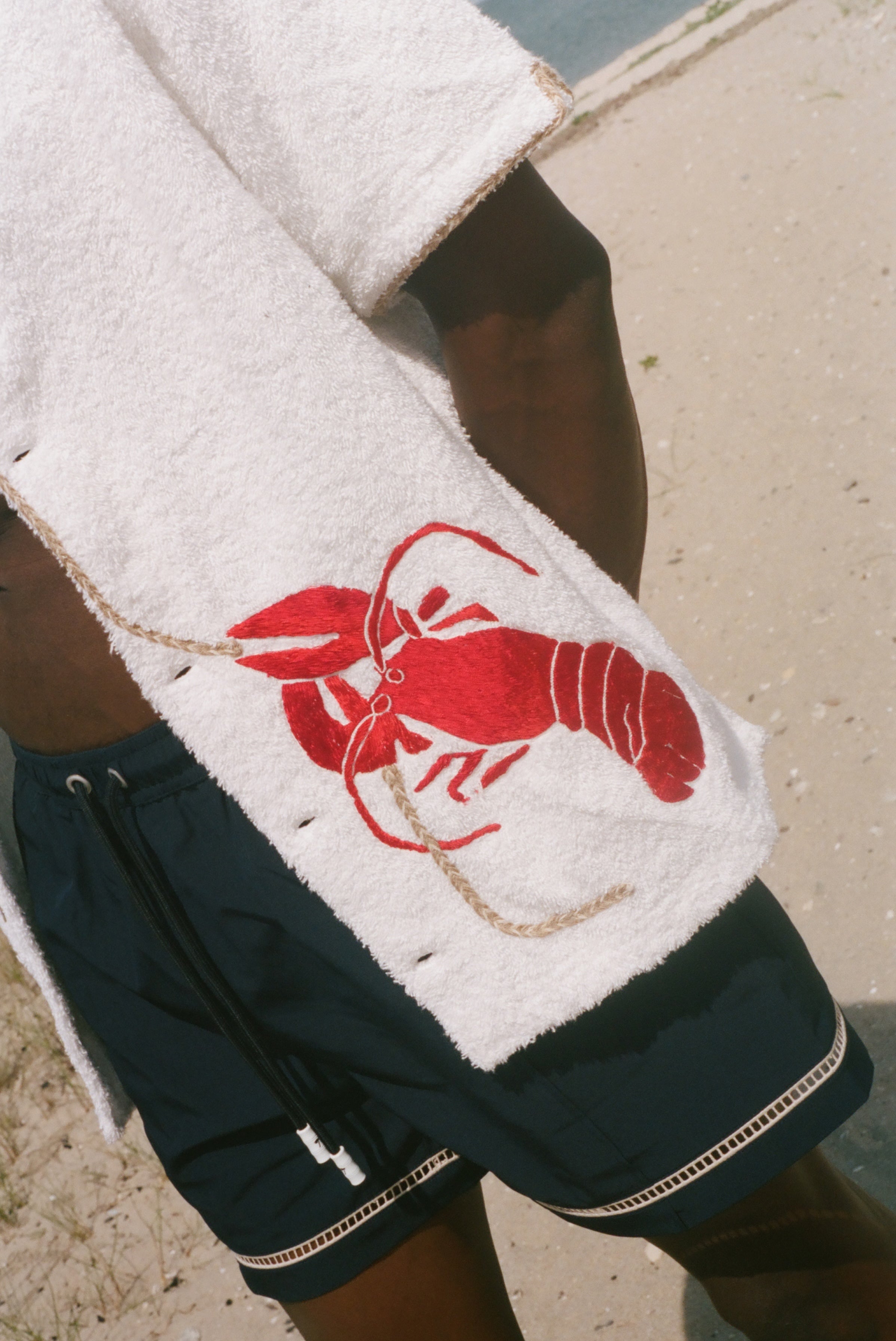 Close-up image of red embroidered lobster.