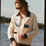 Image of man with long blonde hair, midway through zipping up the 'Blubber' Cabana.