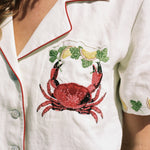 close up of embroidered crab and crab claw