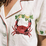 close up of embroidered crab and crab claw