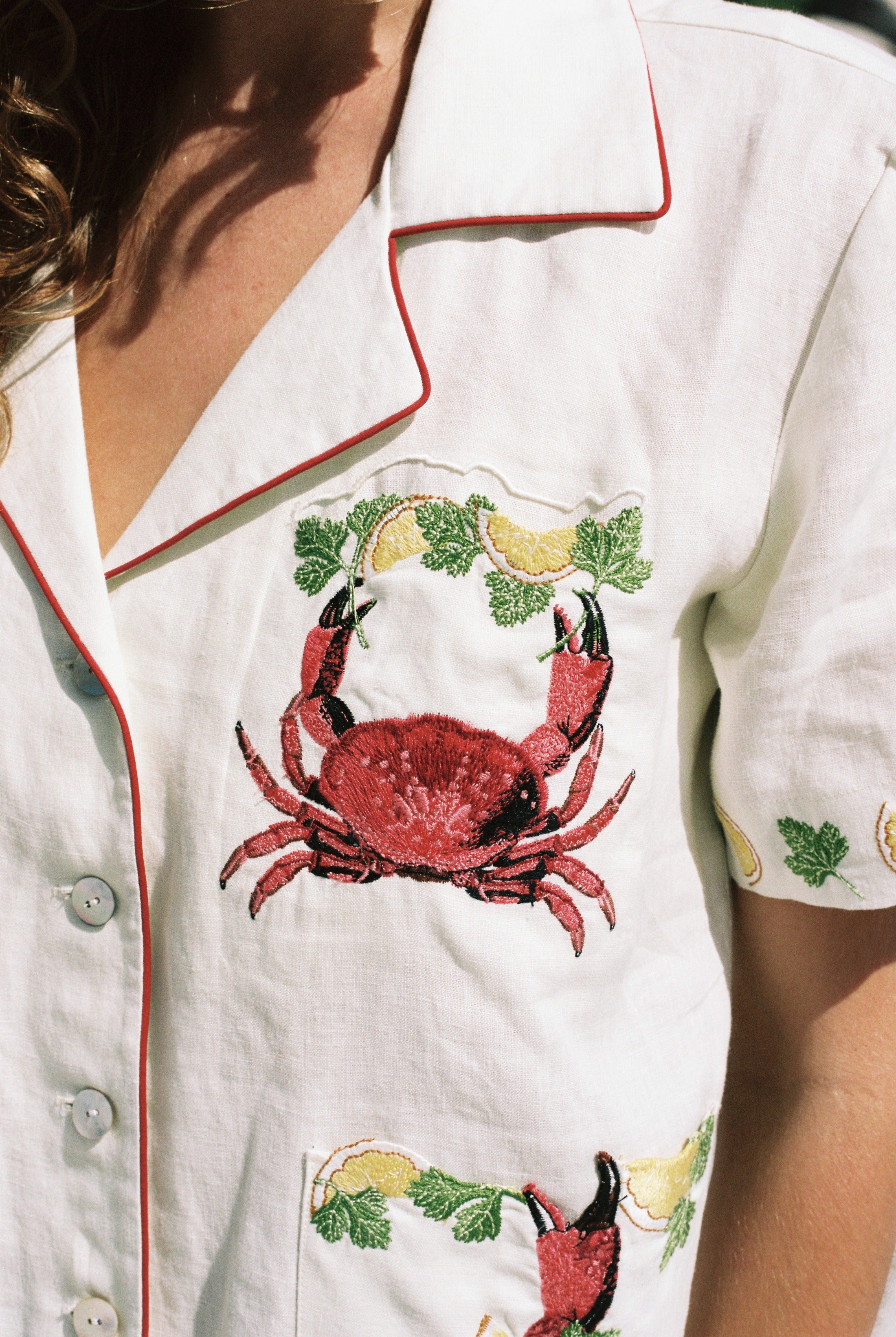 close up of embroidered crab and crab claw