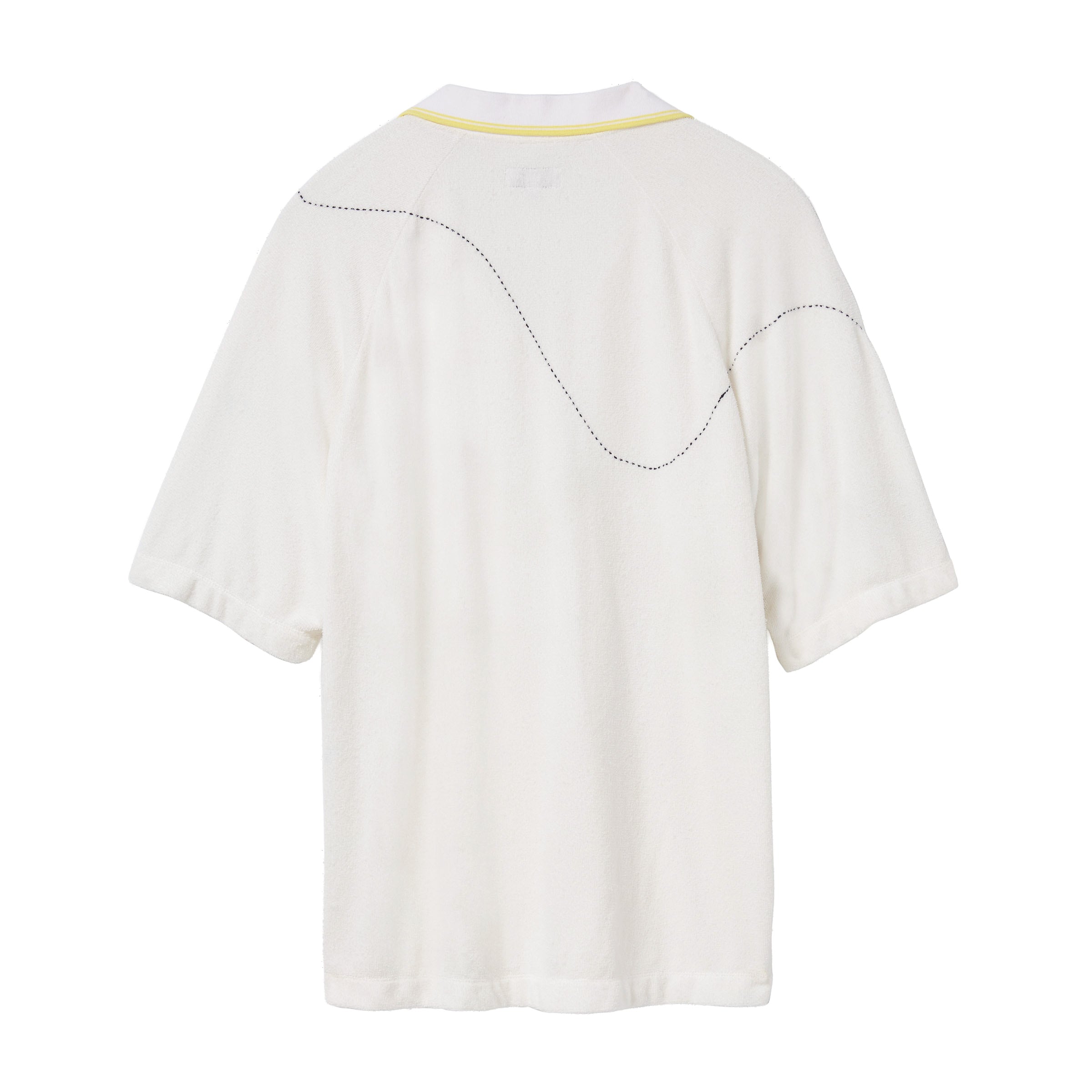 Back of a white terry cloth polo shirt with a yellow-trimmed collar. A curved black dotted line is embroidered across the upper back and shoulders, mimicking the motion of a tennis ball in play.