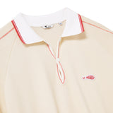 Beige polo shirt with white collar and red accents on a white background
