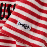 Red and white striped fabric with a 'Tombolo' label.