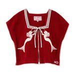 Red top with white trim and mermaid design on a white background