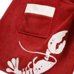 close up of pocket on red tie wrap skirt