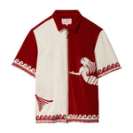 Red and white cabana shirt with mermaid design on a white background
