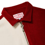 Close-up of red cabana shirt with key zipper pull.